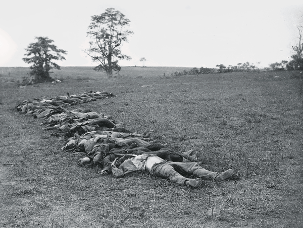 5. Dozens of soldiers lie gathered for interment on the Miller Farm